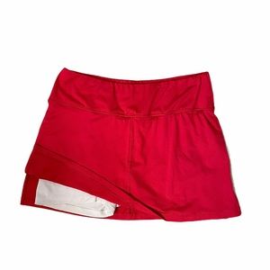 TAIL coral/pink tennis skirt, size Small